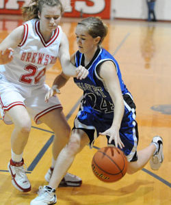 Tonasket junior Karen Keeton dribbles the ball down court while holding off a Brewster defender during Tonasket’s game in Brewster on Friday, Jan. 22. Photo by John F. Cleveland, II