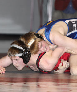 Tonasket junior Lee Leavell, wrestling in the 145 pound weight class, holds his Okanogan opponent, Ryan Kells, in control during Tonasket’s meet in Okanogan on Thursday, Jan. 21. Leavell pinned Kells in the second round with four seconds left. Photo by