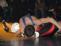 Ryker Marchand of Tonasket pinning Itzel Valera of Chelan in the 112 pound weight class on Friday, Jan. 29 during the Tiger’s final league match of the season. Photo by Emily Hanson