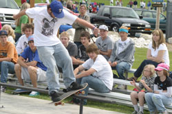 Mo Brown, competing in the 11 to 17 year old age group, rides the rail as the crowd watches at the First Annual T-Town SK8 Throwdown on Saturday, May 22. Brown finished in seventh place in his age group. Photo by Emily Hanson