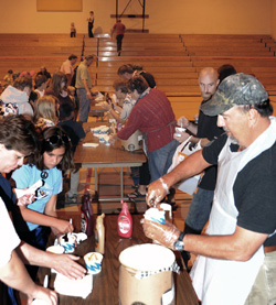 Oroville School Board members serve ice cream to elementary school students and their parents following an open house last Monday evening, Aug. 30, the first day of school for the Oroville School District. Photo by Gary DeVon