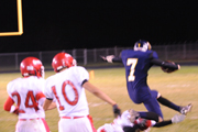 Quarterback Preston Iverson stretches for the goal line bringing the ball within striking distance for the Hornets. Iverson rushed for 72 yards on 20 carries in the State playoff game against White Swan. Photo by Gary DeVon