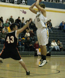 Tonasket senior Brandon Clark makes a jump shot over a Bridgeport defender during the Tigers’ home game against Bridgeport on Tuesday, Dec. 7. Photo by Emily Hanson