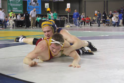 Oroville junior Duke Sykes tries to get Lake Roosevelt junior Sterling Shephard onto his back during the third round of the 171 pound weight class in the B Division at the 2011 Washington Mat Classic XXII Championships on Saturday, Feb. 19. Sykes lost to