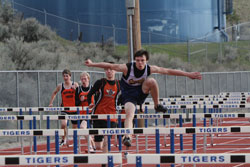 CJ Mathews won the 110 hurdles at the Tonasket Invitational Track meet last Friday. Photo by Terry Mills