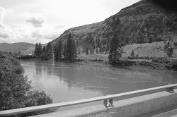 The muddy waters of the Similkameen River at the Nighthawk Bridge flowing toward Oroville. Photo by Gary DeVon