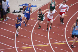 Tonasket junior John Stedtfeld charges toward junior Kris Marthini to hand-off the final round of the men’s 4x100 relay at the 1A State Track Meet in Cheney at Eastern Washington University on Saturday, May 28. Photo by Bob Thornton