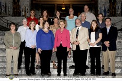 Oroville sixth-grade teacher Jacqueline Marshall (left of Gov. Chris Gregoir, who is center front) and Oroville High School social studies teacher Kelsey Cleveland (second to right of the governor) at the Legislative Scholars Program held in Olympia last