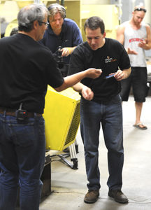 Ryan Skinner, Vice President of Carbon Cycle Crush tastes some of the canola meal produced at the demonstration held at the company's Oroville plant. The meal is highly desired by dairy farmers and poultry farmers for its high C3 Amino Acid content that i