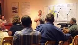 Tonasket City Planner Kurt Danison of Highlands Associates, points out land use designations on the Tonasket map that will pave the way to annexation in the Mill Drive, Seventh Street and Bonaparte Creek area. Photo by Gary DeVon