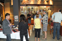 2128a Movie-goers and filmmakers mingle among the displays at the Nk'Mip Desert Cultural Center in Osoyoos, BC during a break at the Tumbleweed Film Festival's Best of Fest. Photos by Gary DeVon
