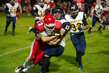 2138a Oroville's Tony Kindred wraps up Brewster quarterback Easton Driessen during the Hornets' 24-7 loss to the Bears on Friday, Oct. 21. Photo by Brent Baker