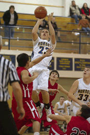 Photo by Brent Baker - The Hornets' Luke Kindred had two key baskets in overtime to help Oroville finish off its 26-point comeback victory over Omak on Wednesday, Dec. 21.