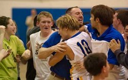 2334a John Stedtfeld (10) is mobbed by teammates, coaches and fans after his buzzer-beater lifted Tonasket to its first CTL victory since 2008.