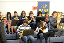 Oroville School Music Director Eric Stiles (far right) accompanies the OHS pep band during the Oroville Hornet Basketball game last Thursday night.