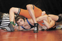 Photo by Brent Baker — The Tigers' Ryker Marchand looks for instruction moments before he pinned his Cashmere opponent on Friday, Feb. 3. Marchand finished third at 126 pounds to qualify for regionals.