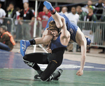 Photo by Brent Baker - Jeffrey Stedtfeld tries to get control of Elma's Tanner Sample during Friday's consolation semifinal match.