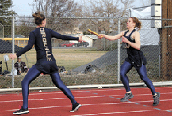 2456a Submitted photo - Oroville's Callie Barker hands off to Kaitlyn Grunst at Ephrata on March 24.