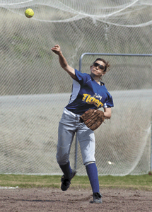 Amber Monroe fires a throw from shortstop during Saturday's doubleheader with Omak.