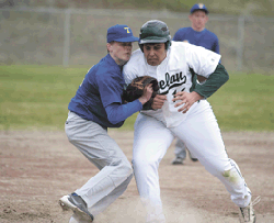2517a Brent Baker / staff photoTonasket's Kjeld Williams was injured in a collision at third base during the Tigers' loss to Chelan last Tuesday.