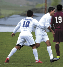 2540a Brent Baker / staff photo — Matilde Pacheca celebrates with Jesus Alvarez (11) after Pacheca scored the equalizing goal late in the first half of Thursday's upset victory over Okanogan.