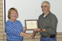 Mayor Chuck Spieth presents a certificate of appreciation to Karen Monroe for her 30 years of service to Oroville. Monroe is the deputy city clerk. Photo by Gary DeVon