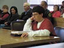 Lacey Kae Hirst-Pavek reads over her court papers while waiting for her sentencing hearing to begin in 2010. Hirst-Pavek was sentenced to life in prison without the possibility of parole for the murder of Michelle Kitterman and 126 months in prison for th