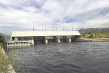 Constructed in 1987, Zosel Dam replaced a wooden structure that served Zosel's Sawmill. The current dam is used to control water levels on Lake Osoyoos under the Oroville-Tonasket Irrigation District as authorized by the state Department of Ecology. The w