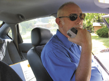 Detective Mike Murray of the Okanogan County Sheriff's office checks out of service after 39 years in law enforcement. The detective, who began his career with the Oroville Police Department retired last Friday. OCSO photo