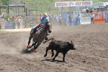 Corey Olson of Chesaw throws a loop in the Junior Breakaway Roping at the Chesaw Fourth of July Rodeo. Olson, who took second place in the Pee Wee Barrels earned Junior All Around Cowboy honors. Photo by Gary DeVon