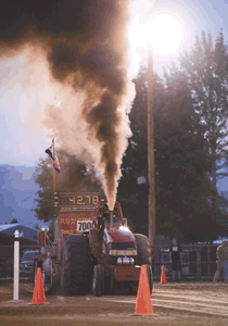 T.J. Tjoelker's "Runnin' in the Red" throws off plenty of heat at Saturday's Truck and Tractor Pulls.