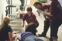 Tonasket EMS practices its response procedures on a pair of "victims" during Saturday's school shooting drill. Photo by Brent Baker