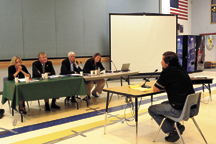 John Artorbum, senior fish biologist with the Colville Confederated Tribes, was the first to testify at the International Joint Commission's public meeting held in Oroville. The IJC Commissioners in attendance were (L-R) Lana Pollack, U.S. Section Chair;