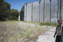 Tonasket city council member Scott Olson (right) envisions a future with a small park, possibly some basketball hoops, murals on the warehouse walls and an improved trail for safe access from town to Chief Tonasket Park, which is beyond the trees at left.