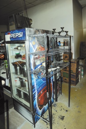 The scorched cooler and rack where the fire started at Hometown Pizza and Pasta in Oroville in the early hours of Sunday morning. Photos by Gary DeVon/staff photo