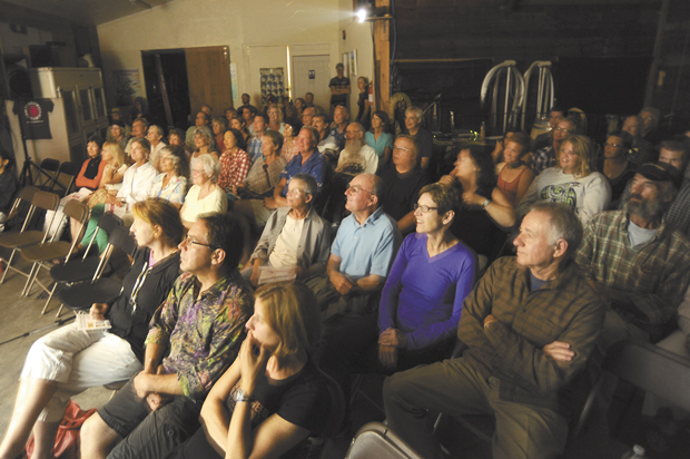 Movie-goers watch one of several short films from the 2013 Tumbleweed Film Festival inside the Esther Bricques Winery barrel room last Saturday evening. The winery has quickly become the most popular of the festival’s serveral venues. It truly represents the festival’s motto of “Watch Globally, Drink Locally.” Gary DeVon/staff photos