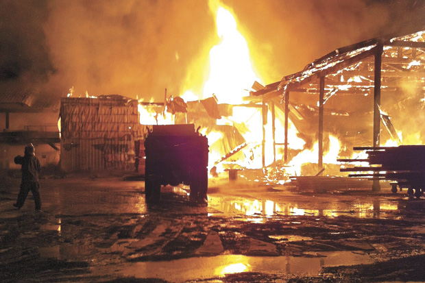 Oroville Fire and Ambulance responded to a fire at Zosel’s chip mill off Jennings Loop Road early Thursday morning. Debra Donahue, Oroville Ambulance Coordinator, captured the fire as the building housing a small log machine was still on fire. The building and the unused machine were totally destroyed according to Howard Zosel. However, the chip mill itslelf remained undamaged due to the efforts of Oroville firefighters and the use of the city’s recently aquired 50-foot ladder truck, which was used to rain down water on the blaze. Debra Donahue/submitted photo