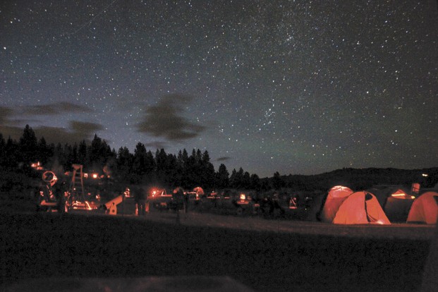 Star gazers at the Table Mountain Star Party at Eden Valley Guest Ranch enjoy a crystal clear night on Thursday, July 24. Amateur astronomers use red light to maintain their dark adapted “night” vision. 