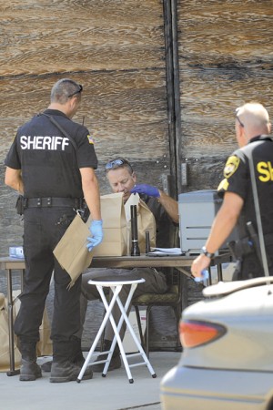 Okanogan County  Sheriff's Deputies served a search warrant and  gathered and tagged evidence at the scene.