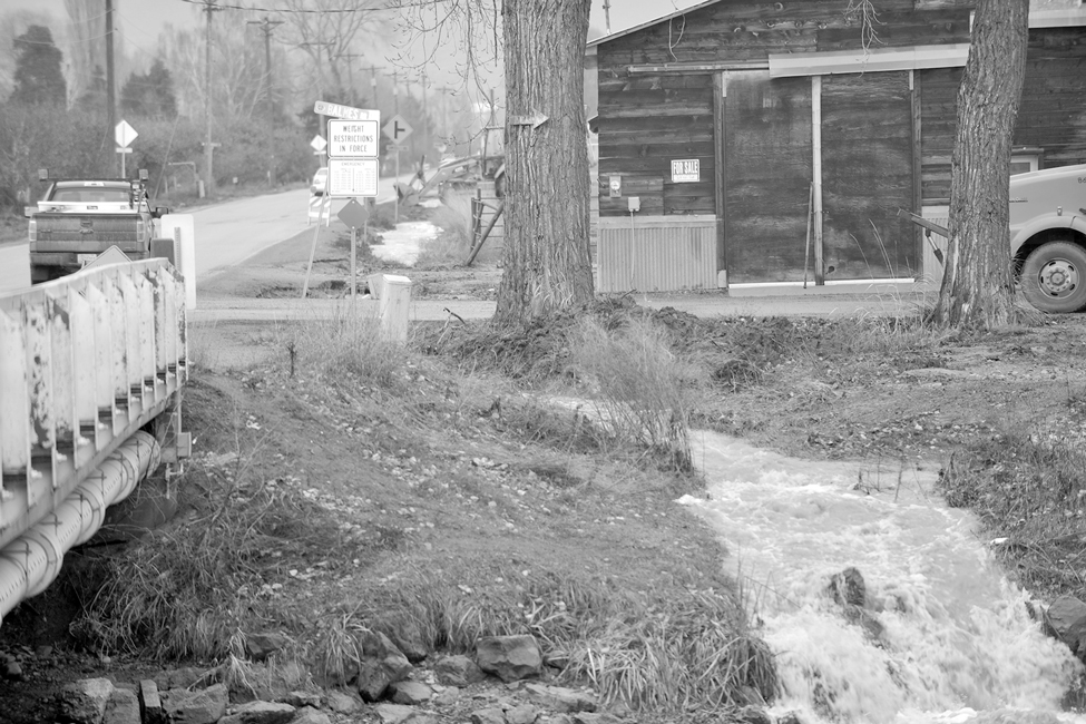 For a few days water from Tonasket Creek, really a combination of rainfall and highland snowmelt, created a miniature falls at the newly carved creek channel flowed into the Okanogan near the Cherry Street Bridge. Gary DeVon/staff photo.