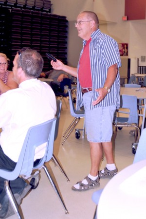 Spence Higby shows one of two concealed holsters he carried into the Gap Training public input meeting. He said that both were empty, but could easily be carried on a school staff member who was authorized to carry a concealed weapon on school grounds for security purposes. Higby, a one-time Oroville School Board member is a former teacher and sporting goods store owner. He said he is still a federally licensed gun dealer.