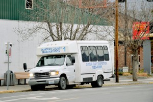 One of the Okanogan County Transportation busses waits outside the main bus stop in Oroville at the Oroville Quick Mart, 76 Station. Gary DeVon/staff photo