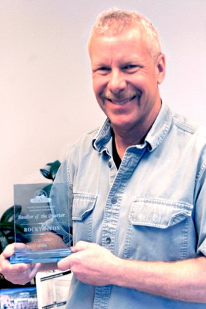 Rocky DeVon with his Realtor of the Quarter Award from the North Central Washington Association of Realtors. DeVon was instrumental in helping to get money from the Realtors Disaster Relief Fund to help people who lost their homes in the Carlton and Okanogan Complex fires. Gary DeVon/staff photo