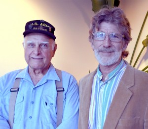 Dan Isaac of Tonasket, left, and Oroville’s Joseph Enzensperger presented Tonasket City Council with a report on the economic risks inherent in the re-electrification of Enloe Dam. Katie Teachout/staff photo