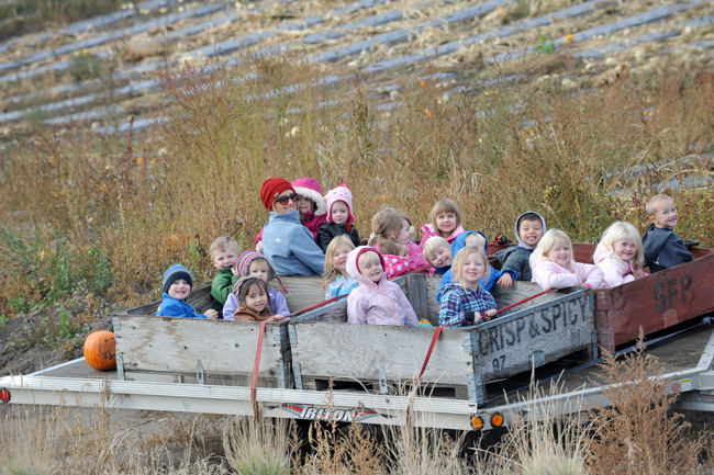 Gary DeVon/staff photo Youngsters got a ride on a trailer and a chance to pick their own pumpkins at Taber's Taste of Summer Fruit Barn a few weeks before Halloween. The pumpkin patch was sponsored by Taber's and Lake and Country RE/MAX Realty in Oroville.