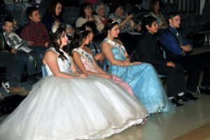 The 2016 May Festival Royalty, Queen Narya Naillon, Princess Zoe Whittaker-Jameson and Princess Lena Fuchs, with stair escorts Zane Scott and Gerardo Castillo watch as this year's royalty candidates are put through their paces.