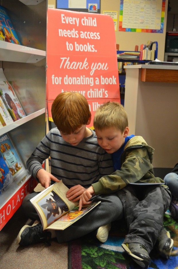 Katie Teachout/staff photo Everett Cody and Gunner Thomas share delight in their new book, "Ninjago Lloyd: A Hero's Journey." I sold a ton of those, along with "Thelma the Unicorn," said parent volunteer Debby Green, who has organized the Scholastic Book Fairs for TES the past 16 years. 