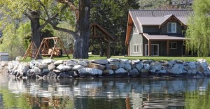 DOE/submitted photo Hardscaped bulkhead and fill will be removed from shoreline as part of a settlement on Lake Osoyoos in Okanogan County.