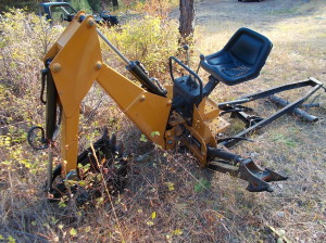 The backhoe attachment.