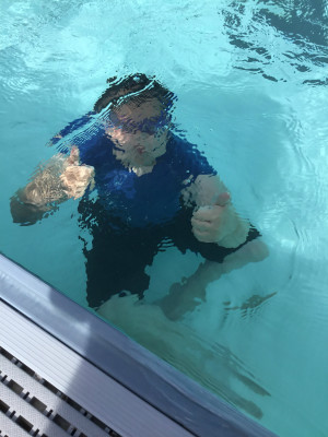 Trained Water Safety Instructors and lifeguards work with elementary students to achieve level one of the American Red Cross water safety.